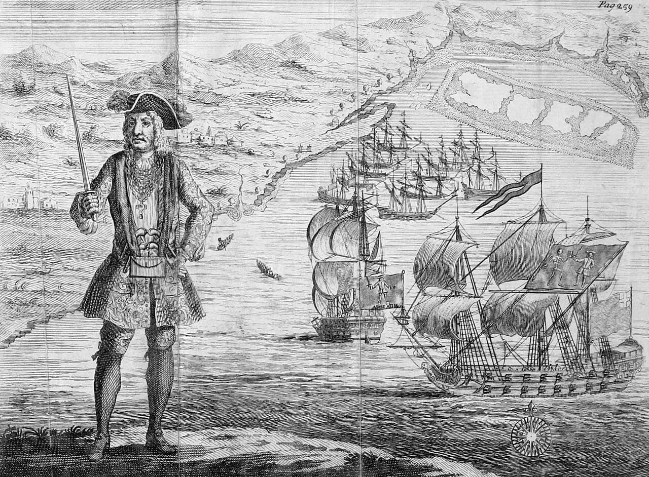 Engraving of Bartholomew Roberts in finery before his two ships off the Guinea coast